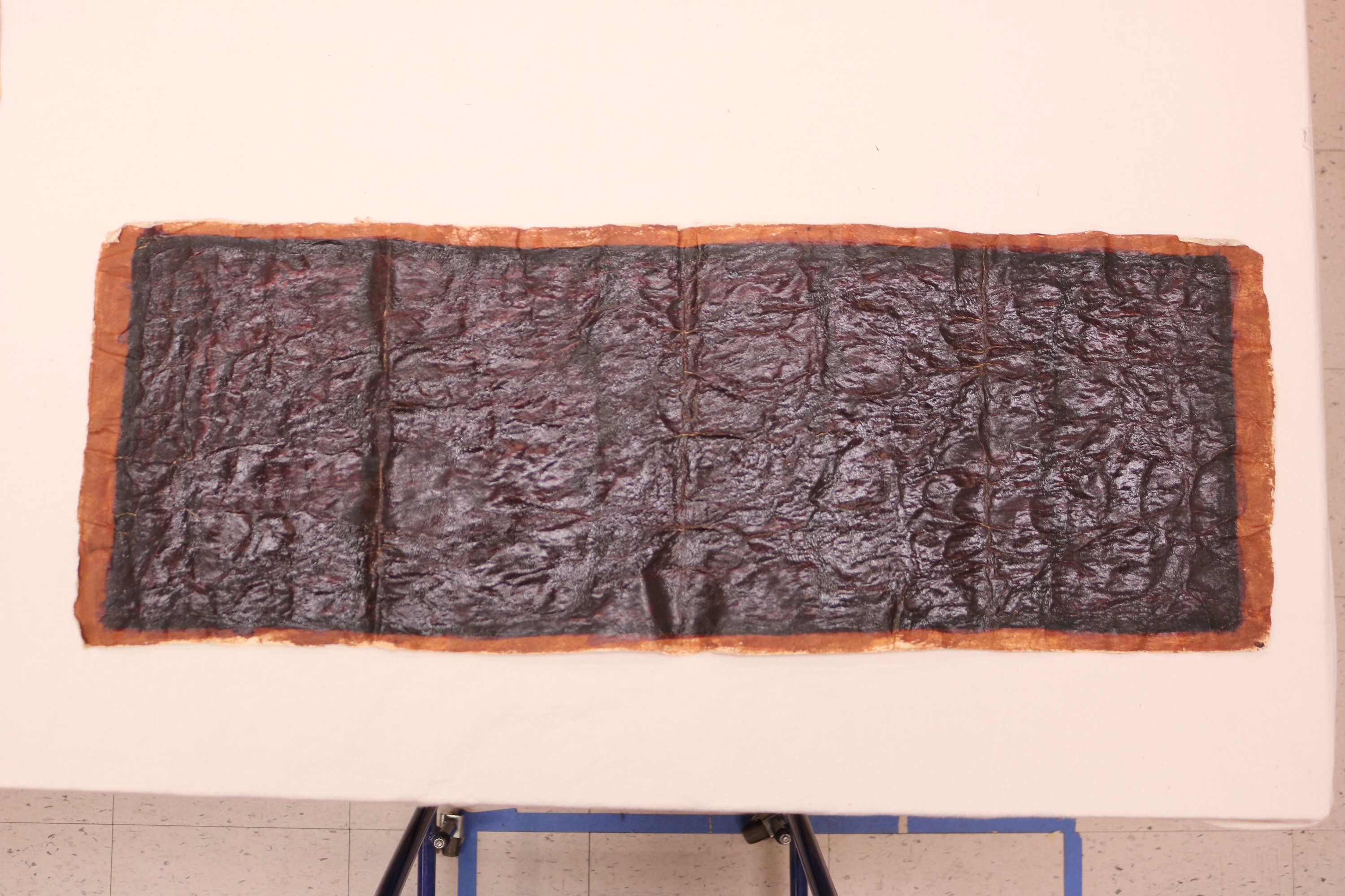 A painted barkcloth (siapo) that appears completely black due to oxidized dye